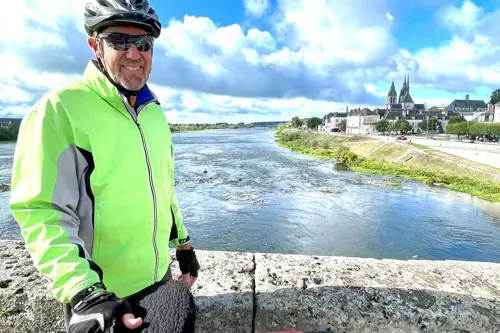 Man biking on bridge in France